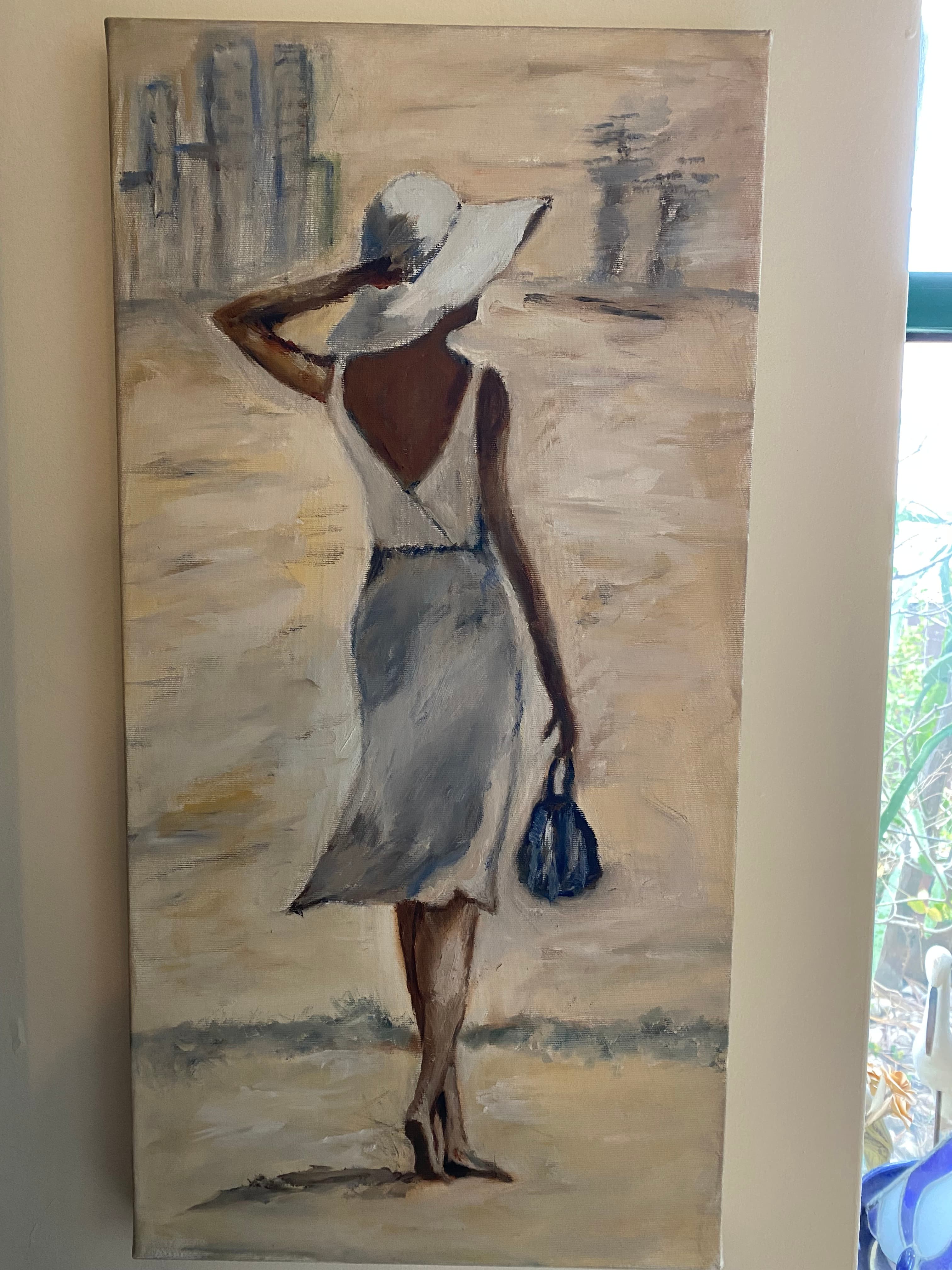A woman with a white hat against an urban landscape background